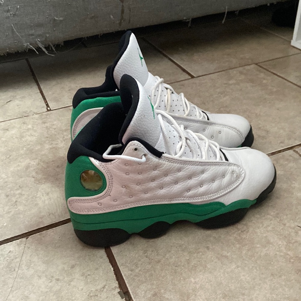 Green and white Jordan 13s